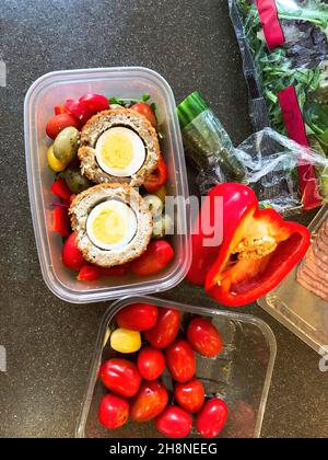 Packed lunch of salad and scotch eggs. Stock Photo