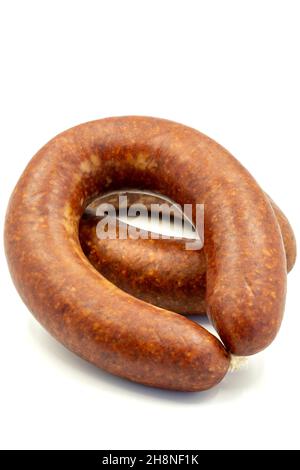 Turkish sausage on a white background. Sausage made from beef. Kangal sausage. Vertical view. close up Stock Photo