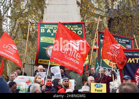 London, UK. 1st December 2021. Transport workers, union members and supporters gathered at Old Palace Yard outside Parliament in protest against threats to salaries and pensions, and threats to services and jobs, which were imposed as part of the bailout of Transport For London. Credit: Vuk Valcic / Alamy Live News Stock Photo