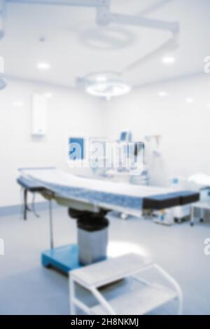 Blurry empty interior operating room and modern equipment in hospital.Medical device for surgeon surgical emergency patient in blue tone style.Save Stock Photo