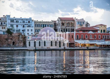 The Kucjk Hassan Mosque in the old harbour of Chania is an ancient Ottoman building from 1645, Chania, Crete, Greece, October 15, 2021 Stock Photo