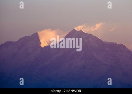 Sunrise on the peaks of Manaslu (left) and Ngadi Chuli/Peak 29 in the Mansiri Himal.  Seen from Bandipur, Nepal. Stock Photo