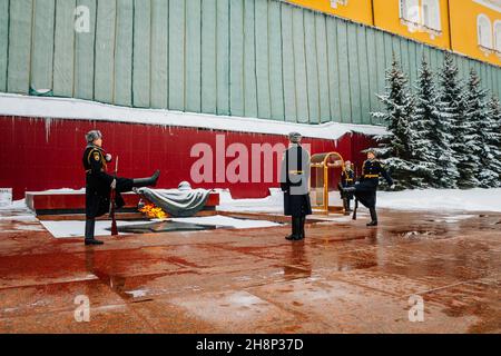 Changing of guard of honor at Moscow Kremlin in winter. Soldiers in military uniform. The famous place is Eternal Flame in memory of those killed in W Stock Photo