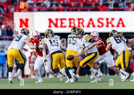 November 26, 2021 - Lincoln, NE. U.S. - Iowa Hawkeyes quarterback Spencer Petras #7 hands off to running back Tyler Goodson #15 in action during a NCAA Division 1 football game between Iowa Hawkeyes and the Nebraska Cornhuskers at Memorial Stadium in Lincoln, NE. .Iowa won 28-21.Attendance: 86,541.382nd consecutive sellout.Michael Spomer/Cal Sport Media Stock Photo