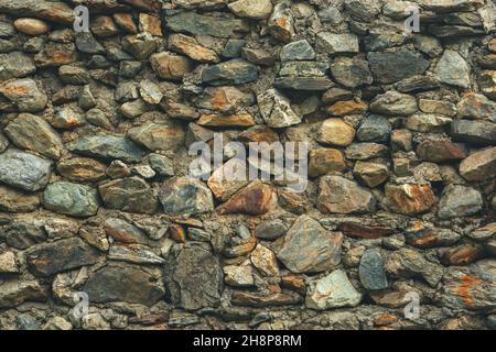 Texture of a stone wall. Old castle stone wall texture background. Stone wall as a background or texture. Part of a stone wall, for background or text Stock Photo