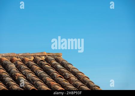 Old Spanish Tile Roof with Blue Sky Stock Photo