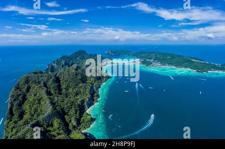 Aerial drone view of tropical turquoise water Maya Bay and limestone cliffs, panorama seascape, season summer holiday to travel amazing  Phi Phi islan Stock Photo