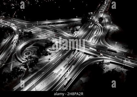 Aerial view Expressway motorway highway circus intersection at Night time Top view , Road traffic in city Stock Photo