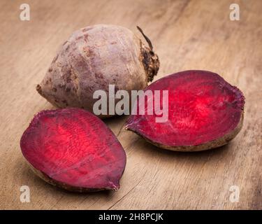 Beetroot on wooden board beets, red, beet, whole, half, halved, beetroot, vegetables, inside, background Stock Photo