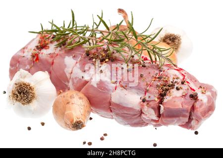 Roast lamb with ingredients roast lamb, lamb, raw, onion, herbs, garlic, rosemary, pepper, black, vegetable Stock Photo