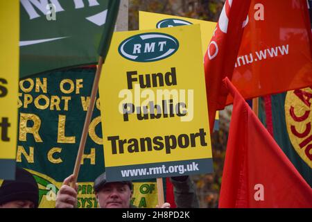 London, UK. 1st December 2021. Transport workers, union members and supporters gathered at Old Palace Yard outside Parliament in protest against threats to salaries and pensions, and threats to services and jobs, which were imposed as part of the bailout of Transport For London. Stock Photo