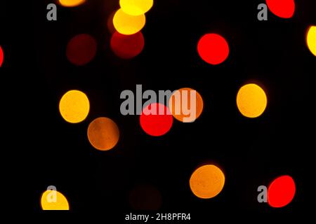 Red bokeh lights background, blurred christmas lights for holiday decoration photo Stock Photo