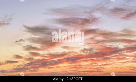 Dramatic red colored clouds in sunset sky. Natural background Stock Photo