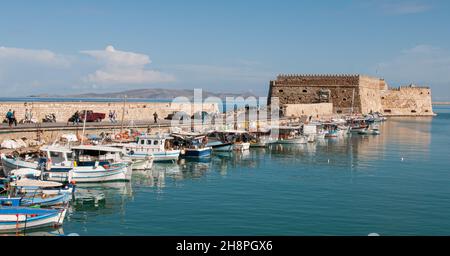 The fishing harbor and the castle at heraklion city in Crete island in Greece Stock Photo