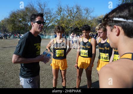 Newbury Park Panthers coach Sean Brosnan talks to Lex Young (1143) , Hector Martinez (1139) and Aaron Sahlman (1140) before the start of the boys Division I race during the CIF State Cross Country Championships at Woodward Park, Saturday, Nov. 27, 2021, in Fresno, Calif. Stock Photo