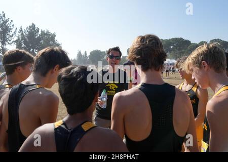 Newbury Park Panthers coach Sean Brosnan talks to runners before the start of the boys Division I race during the CIF State Cross Country Championships at Woodward Park, Saturday, Nov. 27, 2021, in Fresno, Calif. Stock Photo