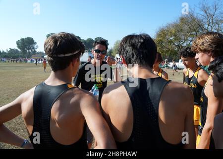 Newbury Park Panthers coach Sean Brosnan talks to runners before the start of the boys Division I race during the CIF State Cross Country Championships at Woodward Park, Saturday, Nov. 27, 2021, in Fresno, Calif. Stock Photo