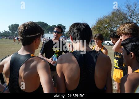 Newbury Park Panthers coach Sean Brosnan talks to runners before the start of the boys Division I race during the CIF State Cross Country Championships at Woodward Park, Saturday, Nov. 27, 2021, in Fresno, Calif. Stock Photo