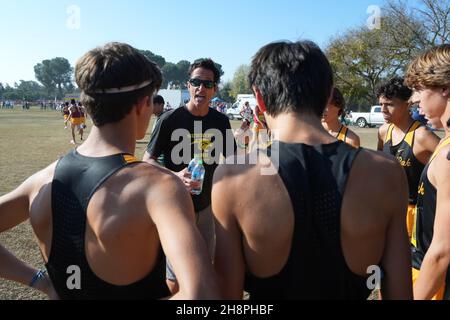 Newbury Park Panthers coach Sean Brosnan talks to runners before the start of the boys Division I race during the CIF State Cross Country Championships at Woodward Park, Saturday, Nov. 27, 2021, in Fresno, Calif. Stock Photo