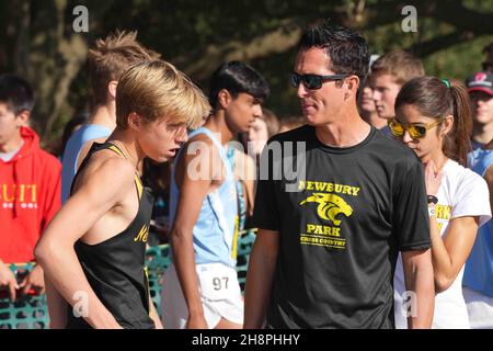 Newbury Park Panthers coach Sean Brosnan (right) talks with Aaron Sahlman (1140) of Newbury Park-SS before the start of the boys Division I race during the CIF State Cross Country Championships at Woodward Park, Saturday, Nov. 27, 2021, in Fresno, Calif. Stock Photo