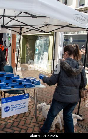 Chesham, Buckinghamshire, UK. 1st December, 2021. Free Covid-19 lateral flow tests were being given out by Buckinghamshire Council to shoppers today in Chesham on market day. The Government are encouraging shoppers to take Covid-19 lateral flow tests before they do their Christmas shopping in attempt to try to keep the rising number of positive Covid-19 cases down. Credit: Maureen McLean/Alamy Live News Stock Photo