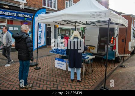 Chesham, Buckinghamshire, UK. 1st December, 2021. Free Covid-19 lateral flow tests were being given out by Buckinghamshire Council to shoppers today in Chesham on market day. The Government are encouraging shoppers to take Covid-19 lateral flow tests before they do their Christmas shopping in attempt to try to keep the rising number of positive Covid-19 cases down. Credit: Maureen McLean/Alamy Live News Stock Photo