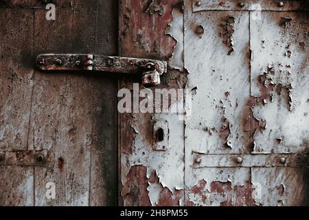 rusty door lock with bolt on weathered wooden door, Valletta, Malta, Europe Stock Photo