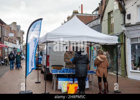 Chesham, Buckinghamshire, UK. 1st December, 2021. Free Covid-19 lateral flow tests were being given out by Buckinghamshire Council to shoppers today in Chesham on market day. The Government are encouraging shoppers to take Covid-19 lateral flow tests before they do their Christmas shopping in attempt to try to keep the rising number of positive Covid-19 cases down. Credit: Maureen McLean/Alamy Live News Stock Photo