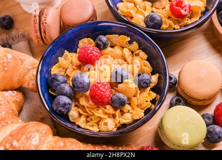 Breakfast cornflakes and macaroon cookies. Delicious and hearty breakfast close-up. High quality photo Stock Photo
