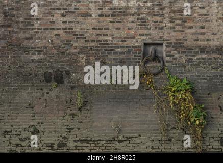 Wall with mooring ring in a historic harbor area. Stock Photo