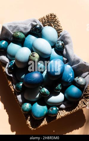 Homemade naturally dyed eggs in blue colors Stock Photo
