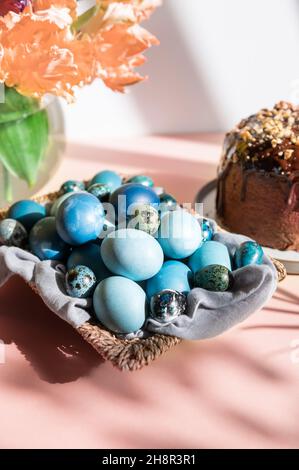 Homemade naturally dyed eggs in blue colors Stock Photo