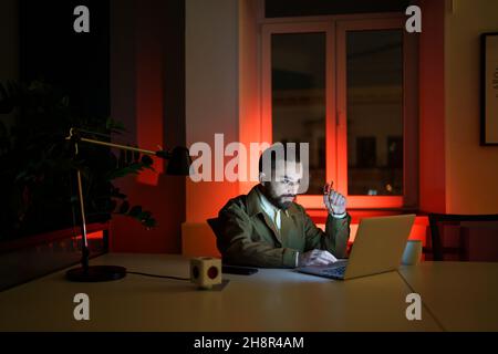 Designer or developer work on website overtime, programmer workaholic stay in office late at night Stock Photo
