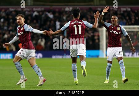 Aston Villa's Ollie Watkins (centre) high fives team mates Ashley Young and Matty Cash after scoring his sides first goal during the Premier League match between Aston Villa and Manchester City at Villa Park, Birmingham. Picture date: Wednesday December 1, 2021. Stock Photo