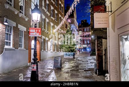 An Alley of Hampstead High Street At Christmas Nightime London UK Stock Photo