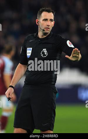 London, UK. 01st Dec, 2021. Referee Chris Kavanagh looks on during the game. Premier League match, West Ham Utd v Brighton & Hove Albion at the London Stadium, Queen Elizabeth Olympic Park in London on Wednesday 1st December 2021. this image may only be used for Editorial purposes. Editorial use only, license required for commercial use. No use in betting, games or a single club/league/player publications. pic by Steffan Bowen/Andrew Orchard sports photography/Alamy Live news Credit: Andrew Orchard sports photography/Alamy Live News
