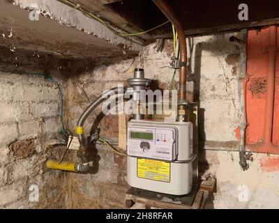 British Gas meter with copper pipes in a cellar England Stock Photo