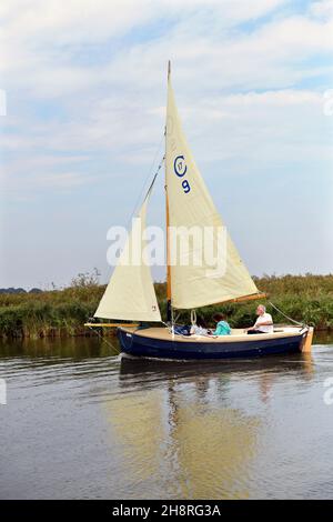 traditional gaff rigged sailing boat close hauled on river thurne at martham norfolk england Stock Photo