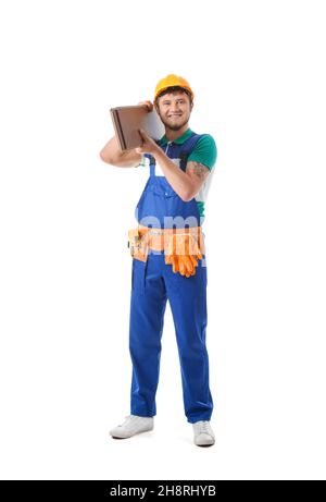 Male builder with wooden plank on white background Stock Photo