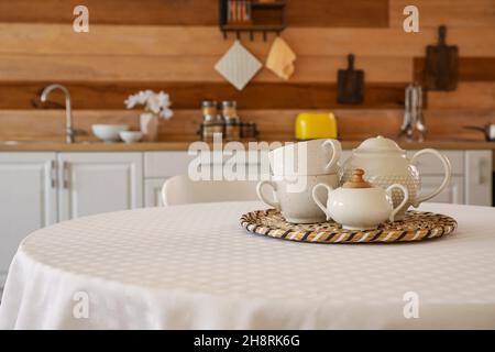 Tea set on dining table in kitchen Stock Photo