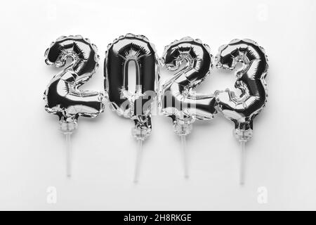 Figure 2023 made of silver balloons on light background Stock Photo