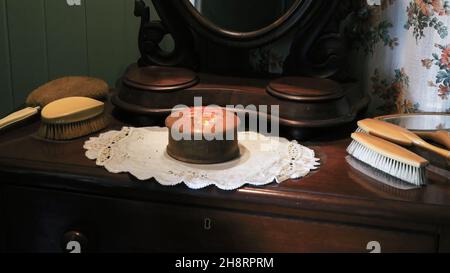 Duchess set of vintage hair brushes and jewelry box on antique furniture with mirror Stock Photo