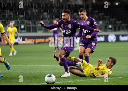 Perth Glory forward Dane Ingham (23) and Wellington Phoenix midfielder Callan Elliot (17) contest the ball Stock Photo