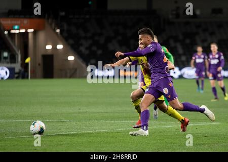 Perth Glory forward Dane Ingham (23) and Wellington Phoenix midfielder Callan Elliot (17) contest the ball Stock Photo