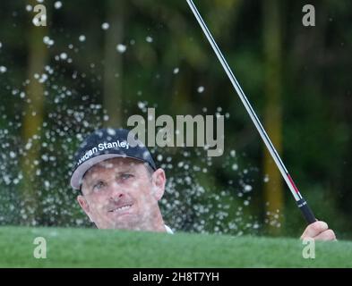 Justin Rose, of England, hits out of a bunker to the sixth green during ...