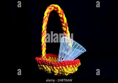 Plastic shuttlecock in handmade nylon basket bag Stock Photo