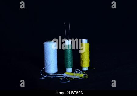 Several rolls of cotton thread are waiting to be used. Stock Photo