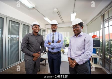 Diverse Group of Engineers, Technicians, Specialists Working on Design for Industrial Engine Prototype. Stock Photo