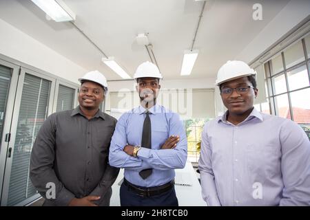 Diverse Group of Engineers, Technicians, Specialists Working on Design for Industrial Engine Prototype. Stock Photo