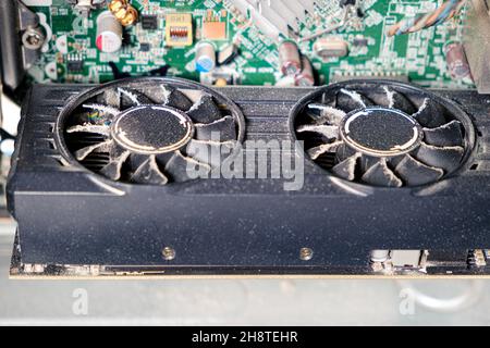 Dirty video card, dust inside the system unit of the computer. Stock Photo